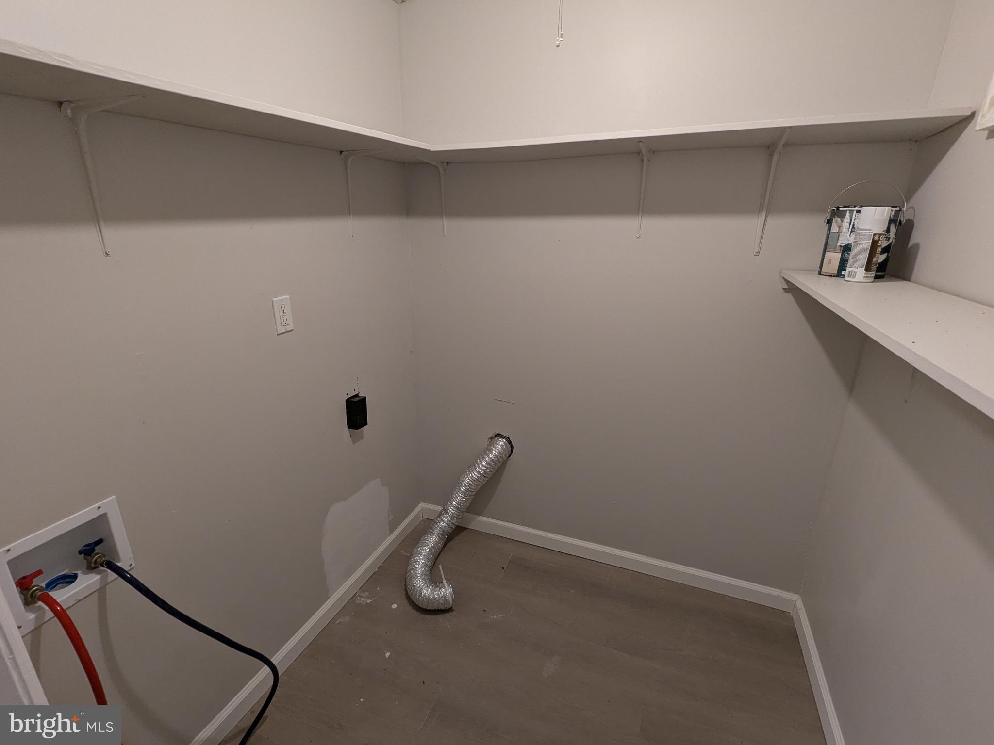 523 East Patapsco Avenue, Unit 1 Baltimore, MD 21225 - Photo 11 of 12 a view of a room with rack on the wall