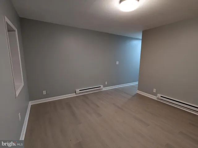 a white toilet sitting next to a bath tub