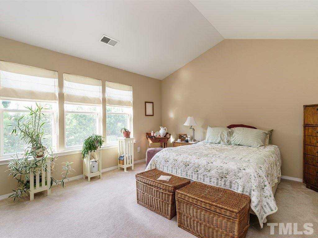 8411 Stonework Drive Raleigh, NC 27613 - Photo 12 of 19 a living room with a bed and furniture