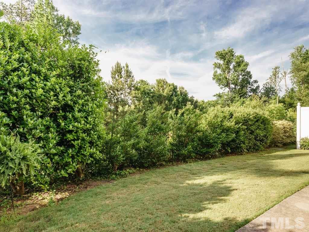 8411 Stonework Drive Raleigh, NC 27613 - Photo 17 of 19 a view of a yard with a tree