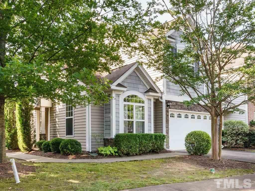 8411 Stonework Drive Raleigh, NC 27613 - Photo 19 of 19 a front view of a house with garden