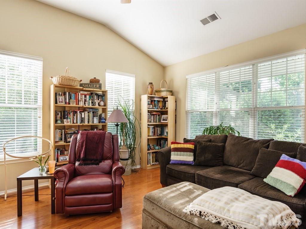 8411 Stonework Drive Raleigh, NC 27613 - Photo 4 of 19 a living room with furniture and a large window