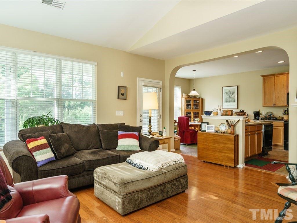 8411 Stonework Drive Raleigh, NC 27613 - Photo 5 of 19 a living room with furniture and a large window
