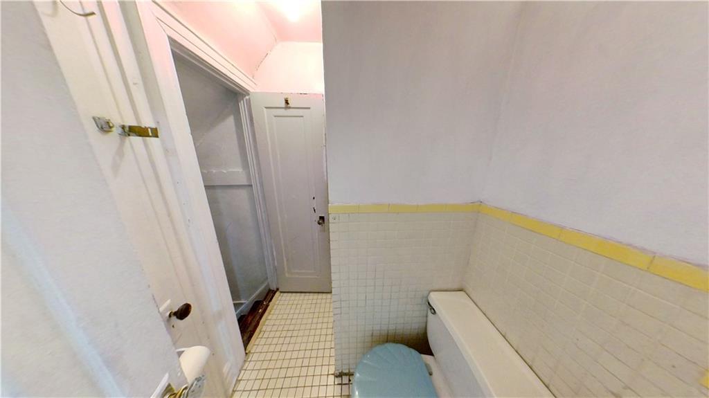 2552 East 19th Street Brooklyn, NY 11235 - Photo 12 of 34 a bathroom with a sink and toilet