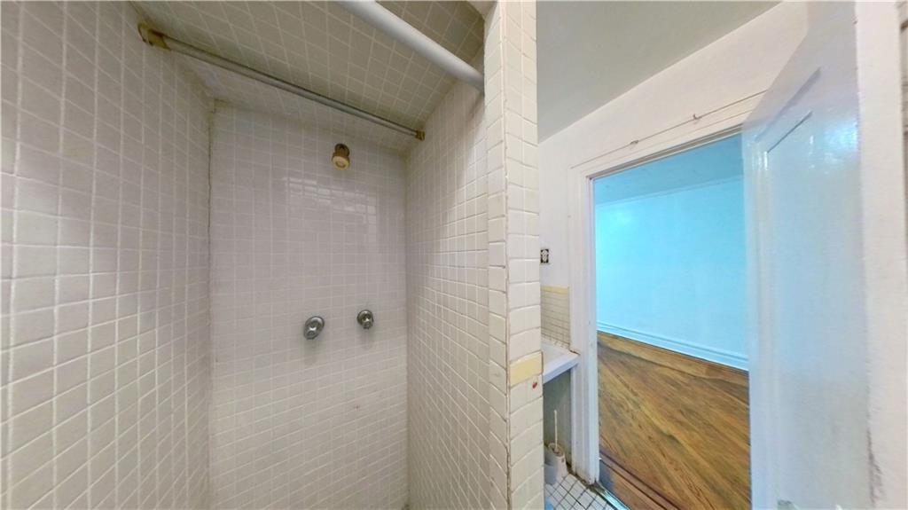 2552 East 19th Street Brooklyn, NY 11235 - Photo 13 of 34 a bathroom with a shower