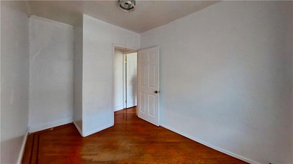 2552 East 19th Street Brooklyn, NY 11235 - Photo 18 of 34 a view of a room with wooden floor