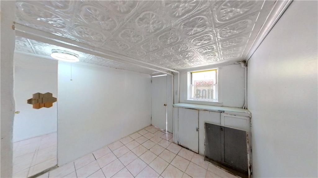 2552 East 19th Street Brooklyn, NY 11235 - Photo 20 of 34 a view of entryway with chandelier