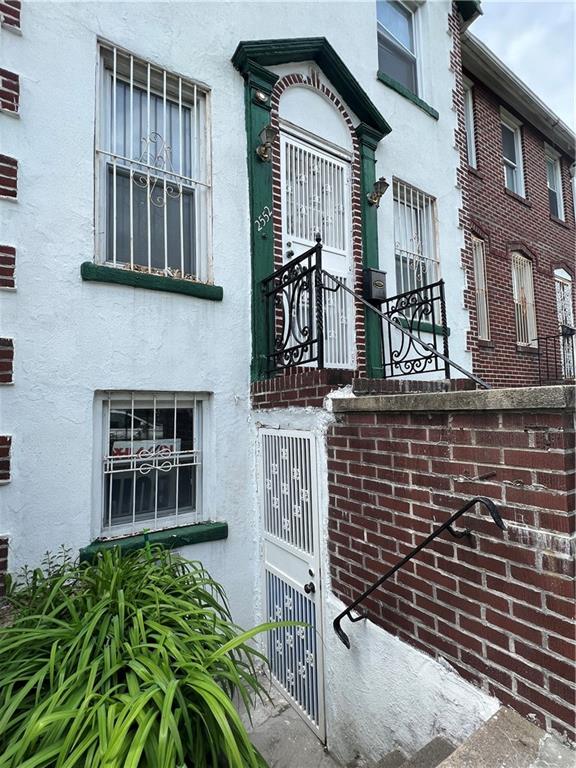 2552 East 19th Street Brooklyn, NY 11235 - Photo 2 of 34 a front view of a house with a garden