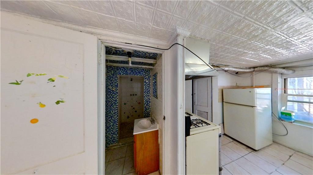 2552 East 19th Street Brooklyn, NY 11235 - Photo 26 of 34 a utility room with dryer and washer