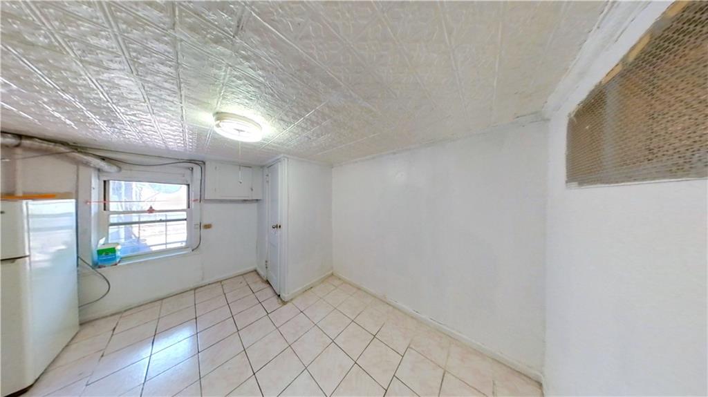 2552 East 19th Street Brooklyn, NY 11235 - Photo 27 of 34 a view of an empty room and window