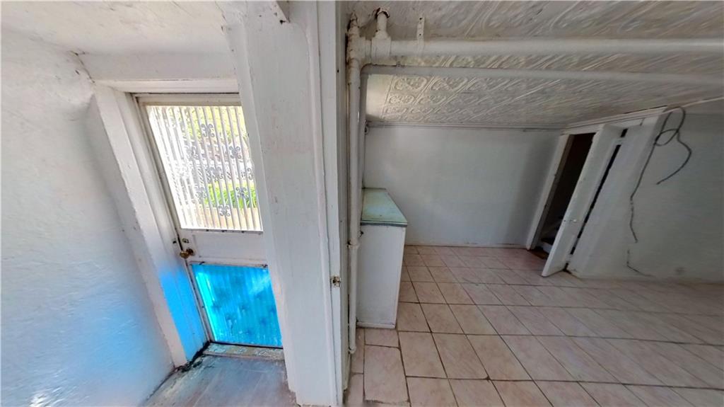 2552 East 19th Street Brooklyn, NY 11235 - Photo 32 of 34 a view of an empty room with a window