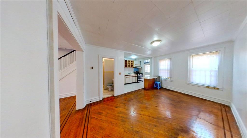 2552 East 19th Street Brooklyn, NY 11235 - Photo 7 of 34 a room with furniture and a large window