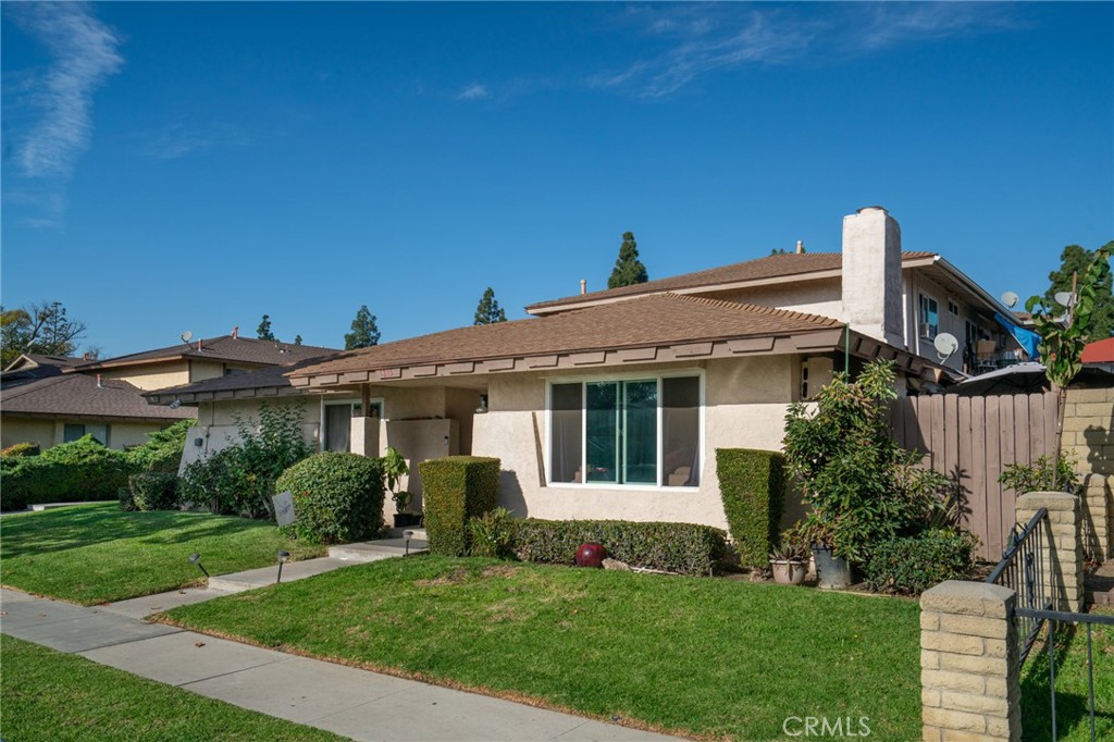 1215 South Athena Way Anaheim, CA 92806 - Photo 2 of 16 a view of a house with a yard