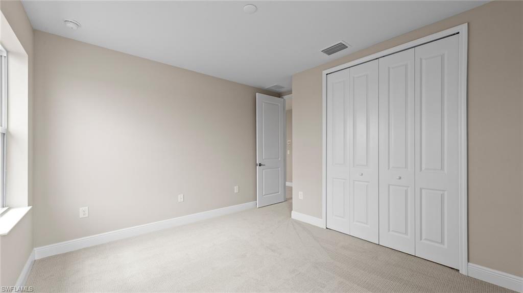 4568 Centaurus Circle Naples, FL 34120 - Photo 28 of 47 a view of an empty room