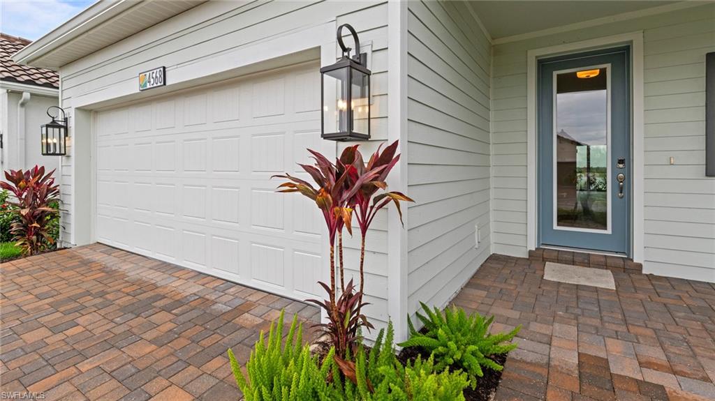 4568 Centaurus Circle Naples, FL 34120 - Photo 3 of 47 a vase of flowers sitting on a floor