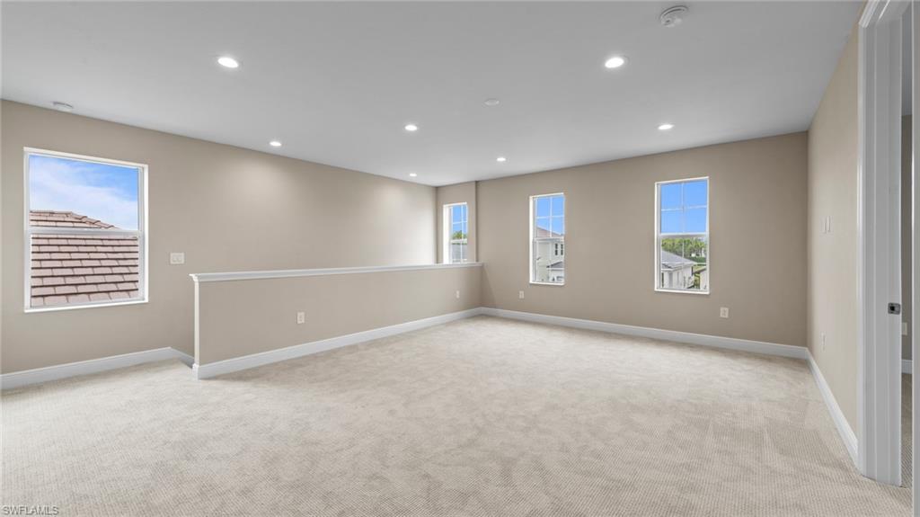 4568 Centaurus Circle Naples, FL 34120 - Photo 36 of 47 a view of an empty room with a window