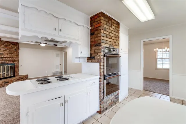 a kitchen that has a cabinets and a stove