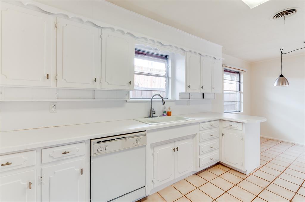 6809 Yolanda Drive Fort Worth, TX 76112 - Photo 13 of 22 a kitchen with white cabinets and white appliances