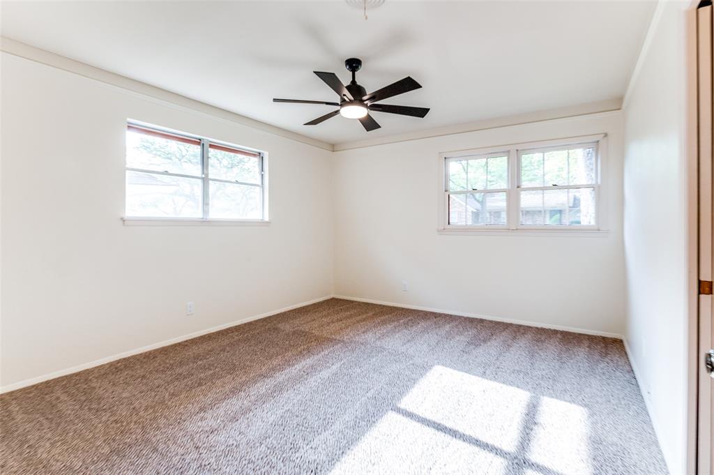 6809 Yolanda Drive Fort Worth, TX 76112 - Photo 15 of 22 an empty room with windows and fan