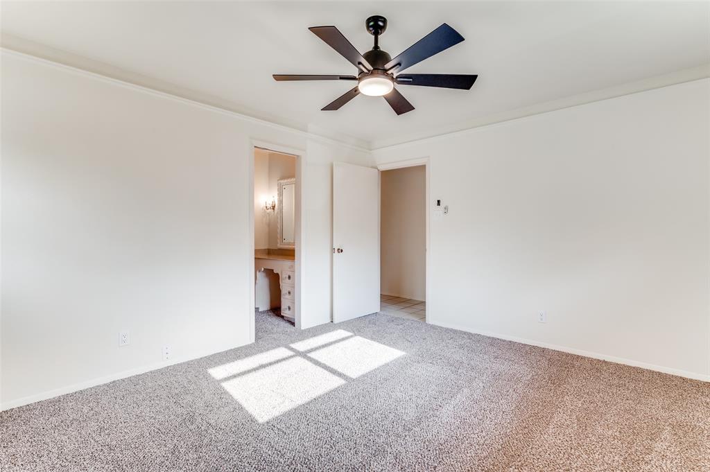 6809 Yolanda Drive Fort Worth, TX 76112 - Photo 16 of 22 a view of a big room with a ceiling fan and a window
