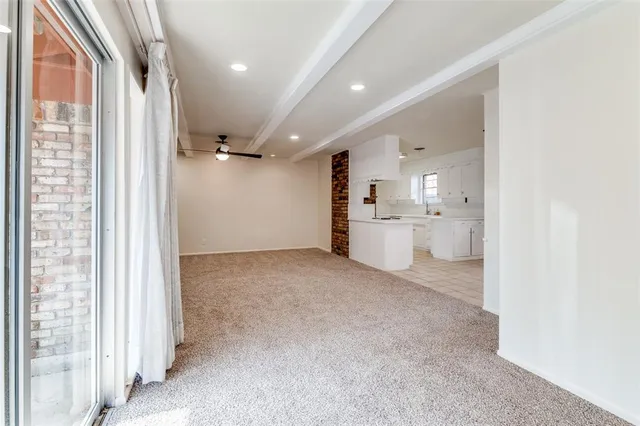 a view of a kitchen with a sink and cabinets