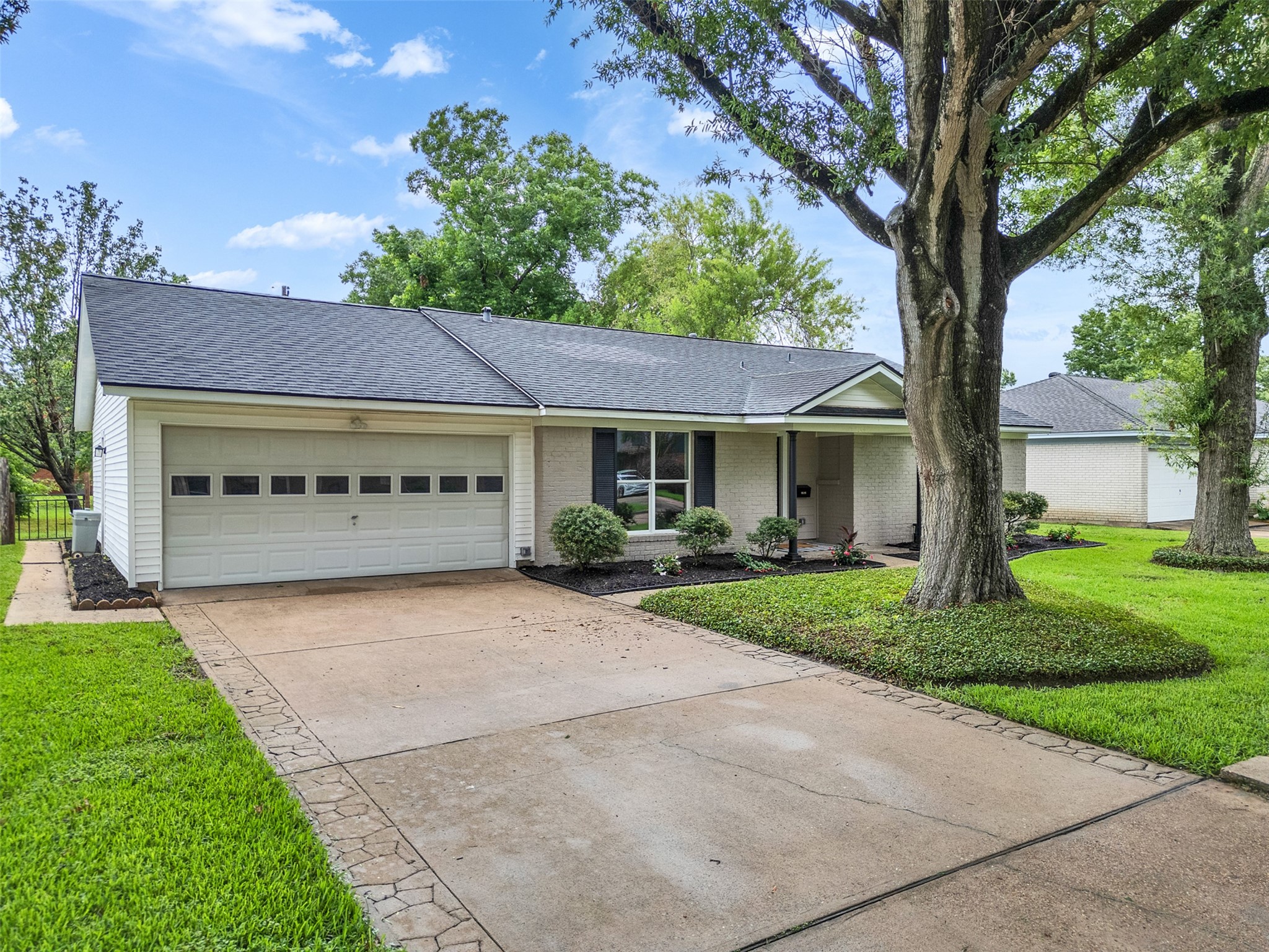 10315 Winding Trail Road La Porte, TX 77571 - Photo 2 of 24 This charming home features a spacious driveway perfect for multiple vehicles, offering convenience and ease for any homeowner.