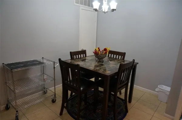 a bedroom with a bed and a mirror