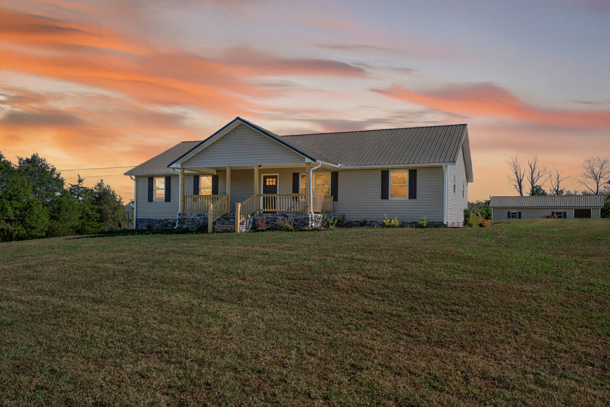 780 Champ Road Flintville, TN 37335 - Photo 1 of 45 a front view of a house with a garden