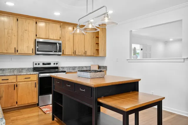 a kitchen with a stove and a microwave