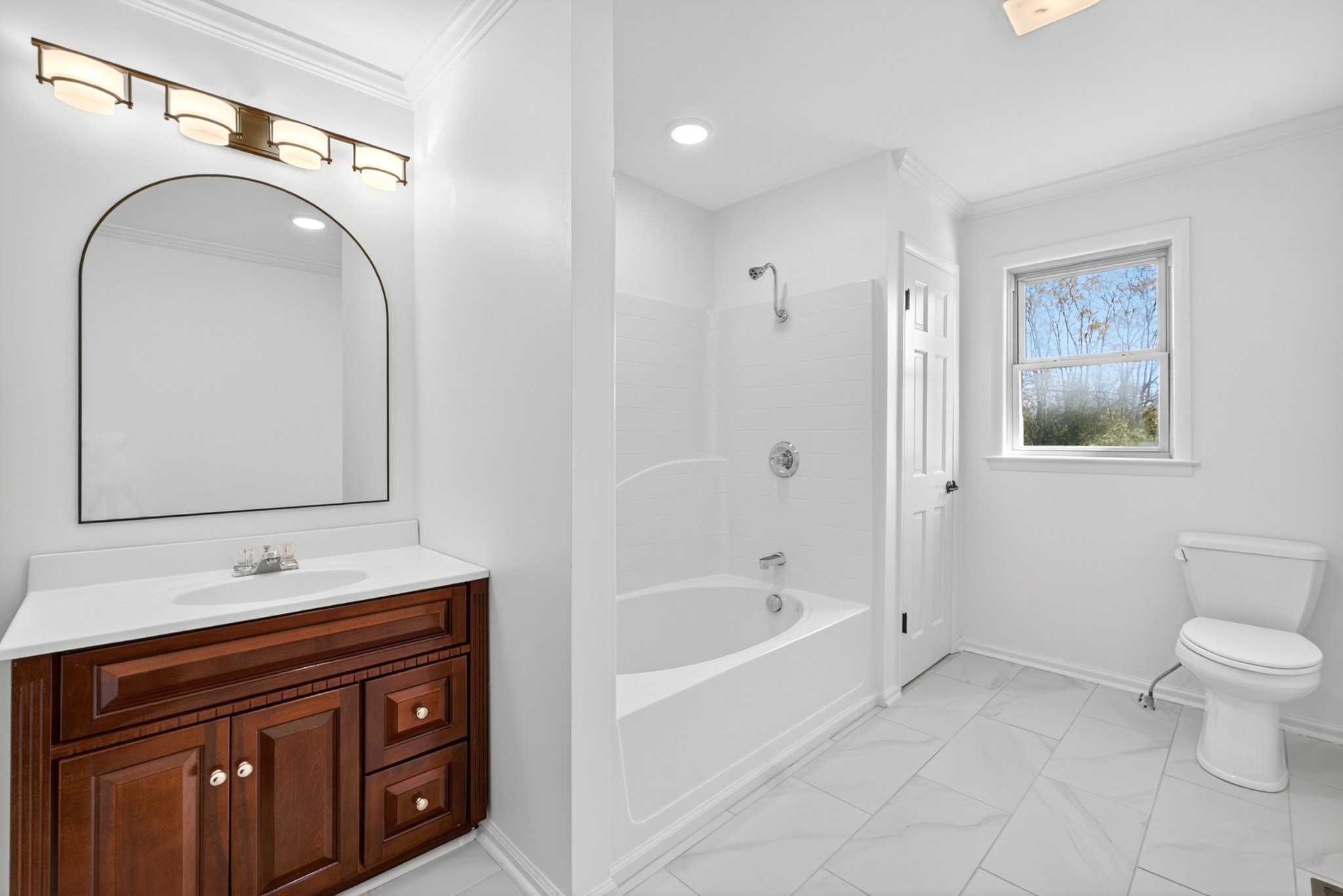 780 Champ Road Flintville, TN 37335 - Photo 21 of 45 a bathroom with a sink a toilet and a mirror