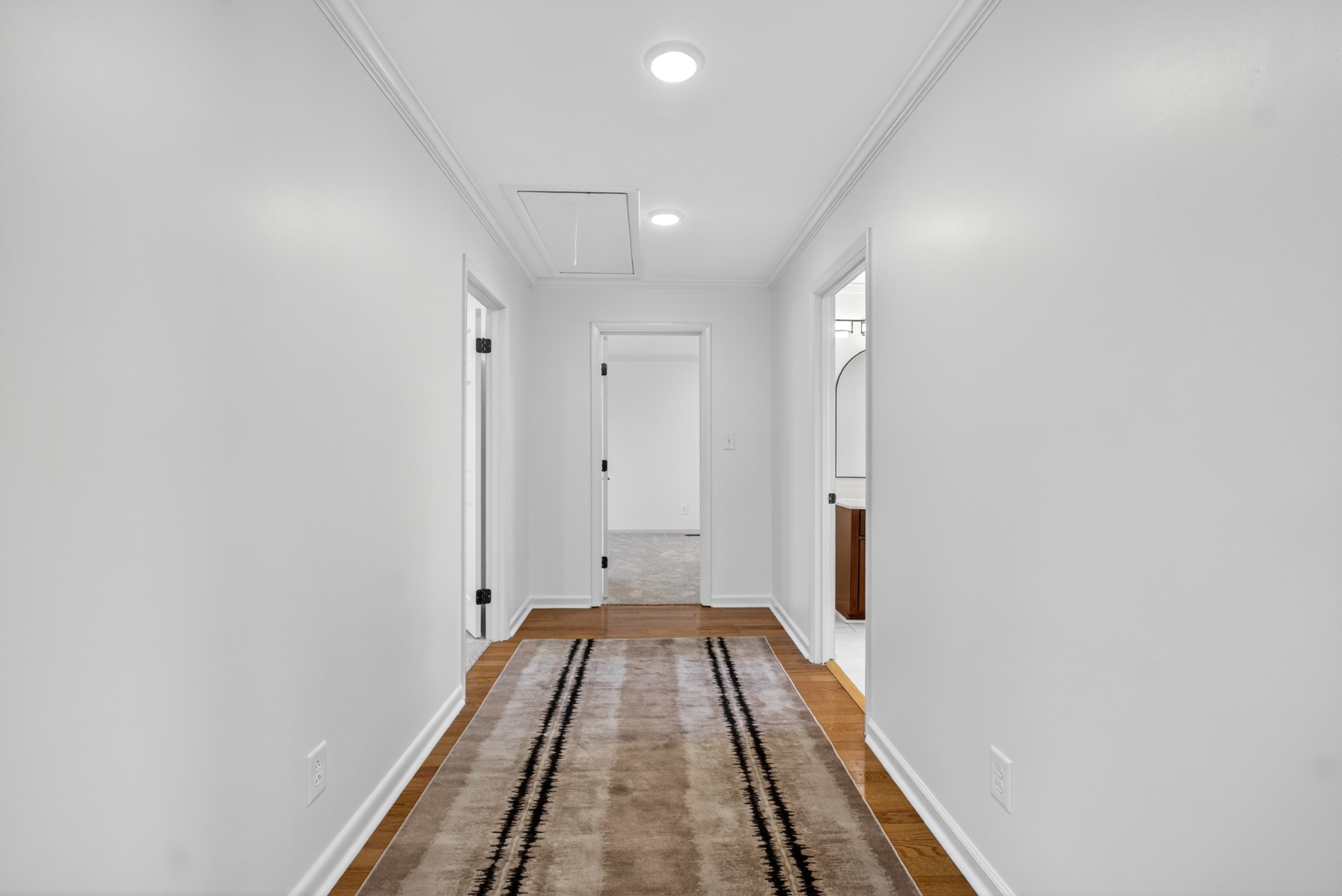 780 Champ Road Flintville, TN 37335 - Photo 25 of 45 a view of a hallway with wooden floor and staircase