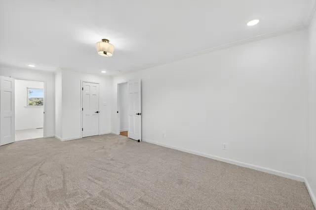 a bathroom with a toilet a sink and a mirror