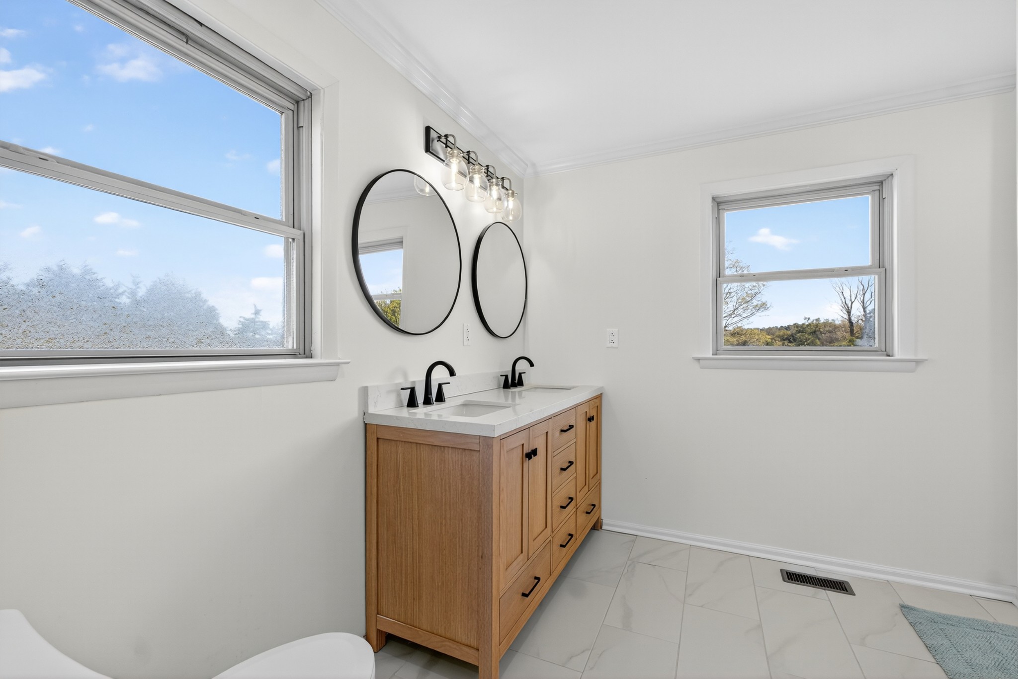 780 Champ Road Flintville, TN 37335 - Photo 30 of 45 a bathroom with a toilet a sink and a mirror