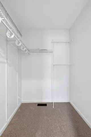 a front view of a house with a brick wall