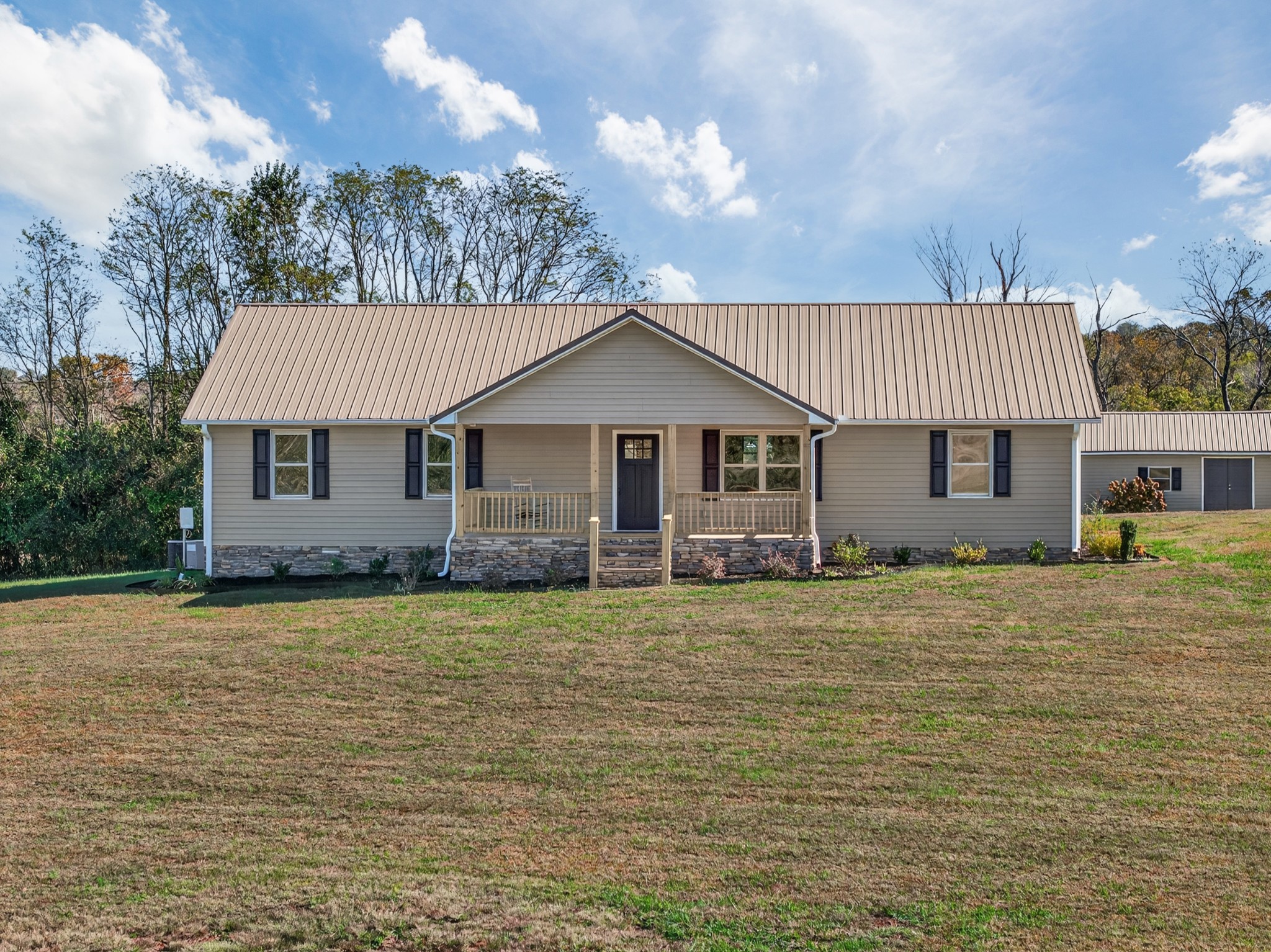 780 Champ Road Flintville, TN 37335 - Photo 35 of 45 a front view of a house with a garden