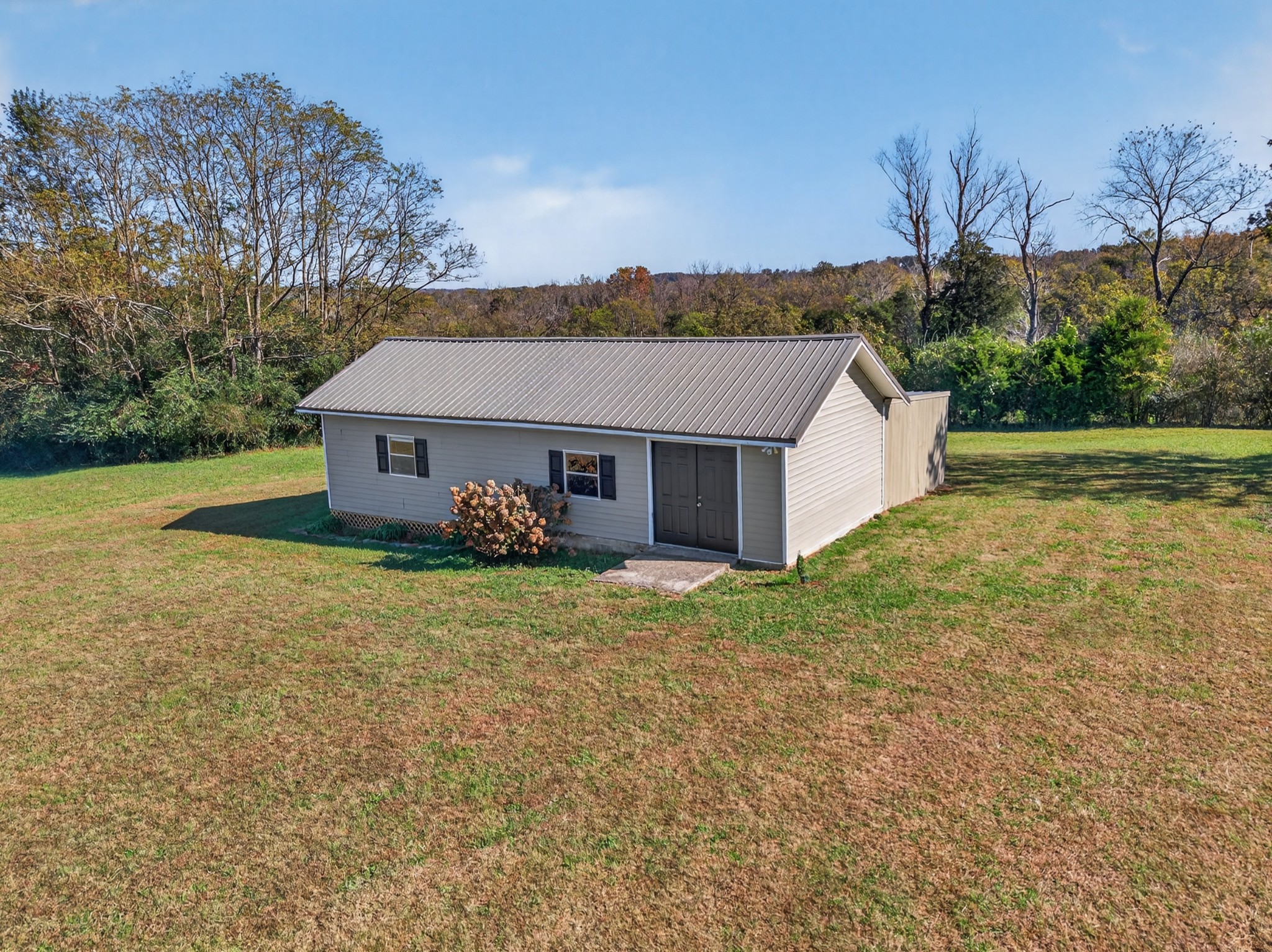 780 Champ Road Flintville, TN 37335 - Photo 41 of 45 a house with huge green field in front of it