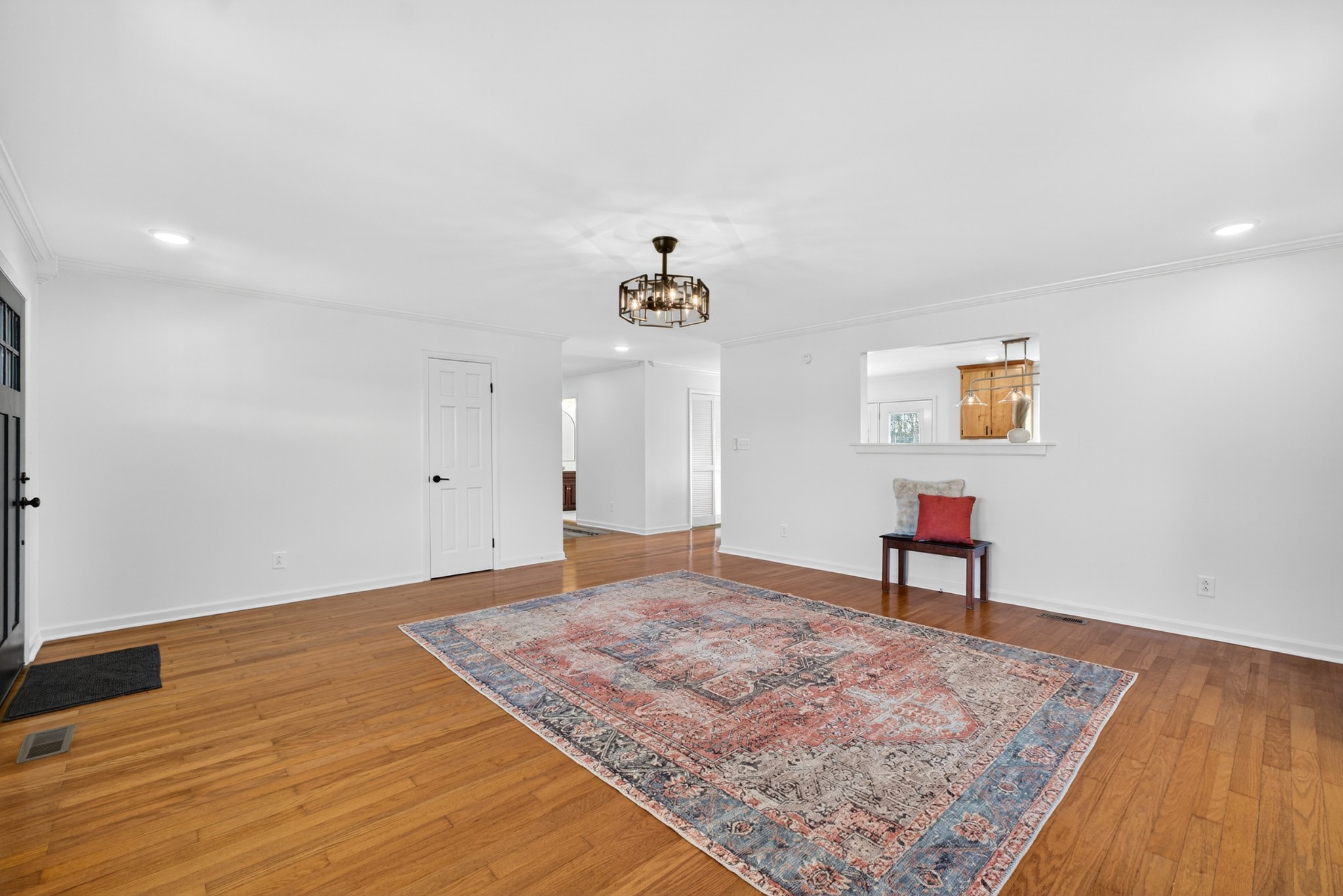 780 Champ Road Flintville, TN 37335 - Photo 9 of 45 a view of an empty room with a window and wooden floor