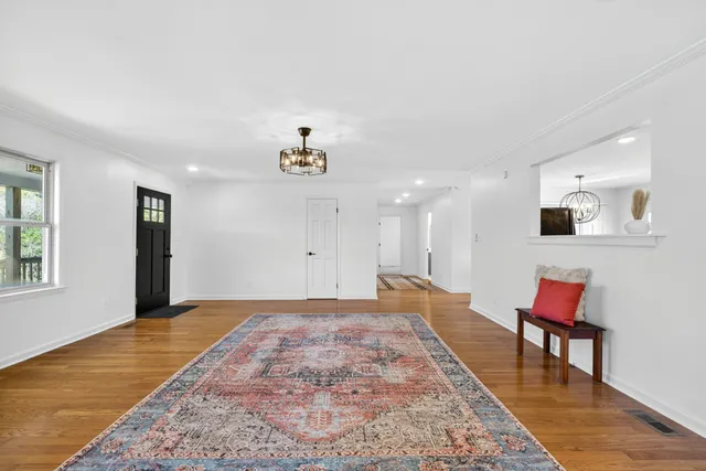 a view of a livingroom with furniture and wooden floor