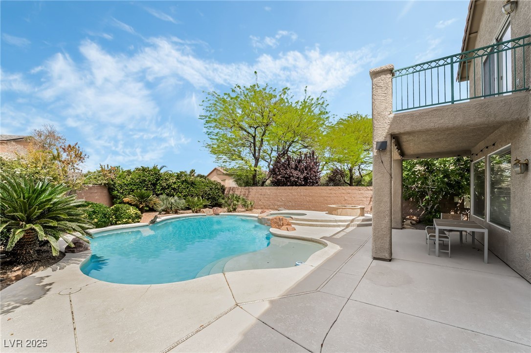 2392 Rainswept Avenue Henderson, NV 89052 - Photo 41 of 49 View of pool with a fenced backyard, a pool with connected hot tub, and a patio