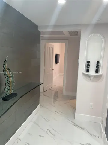 a bedroom with a bed and a view of bathroom