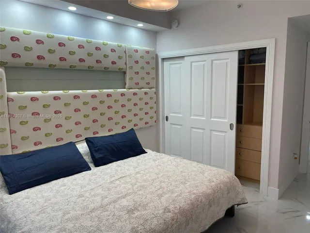 a bathroom with a toilet a sink and a mirror