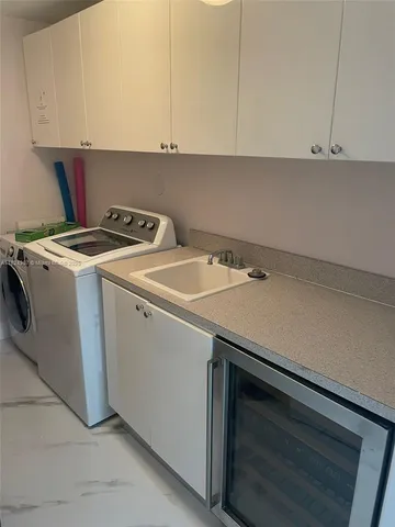 a bedroom with two beds and a large mirror