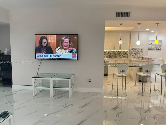 a view of kitchen with furniture and cabinets