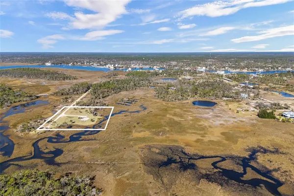 an aerial view of residential building and ocean