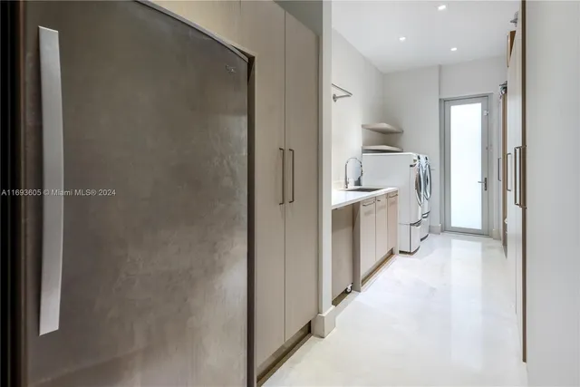 a view of a livingroom with furniture and floor to ceiling window
