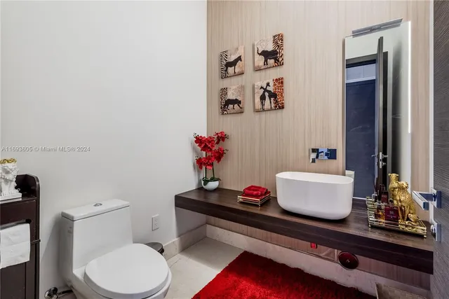 a view of empty room with window and wooden floor