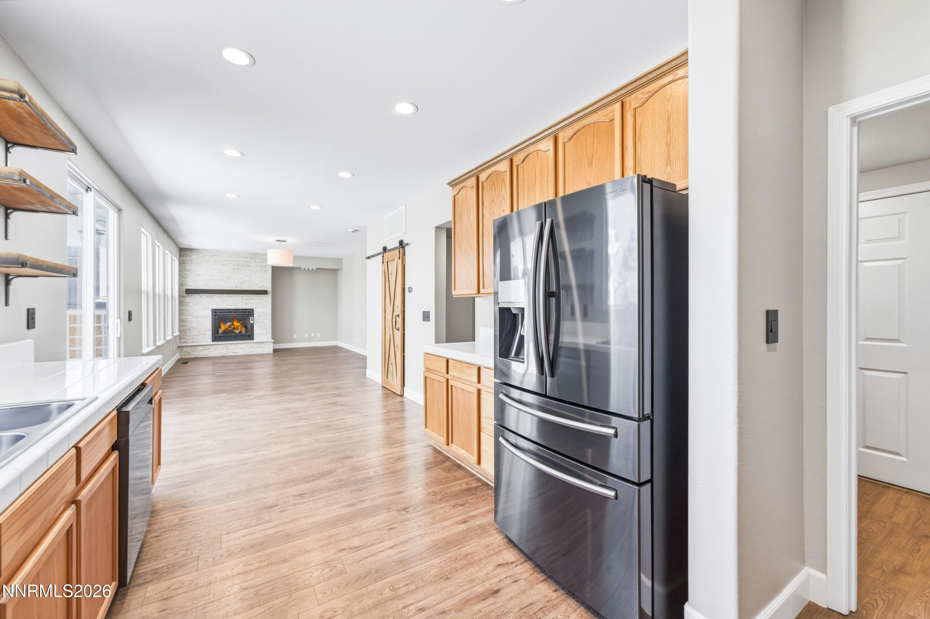 1770 Kodiak Circle Reno, NV 89511 - Photo 13 of 32 a kitchen with stainless steel appliances granite countertop a refrigerator and a sink