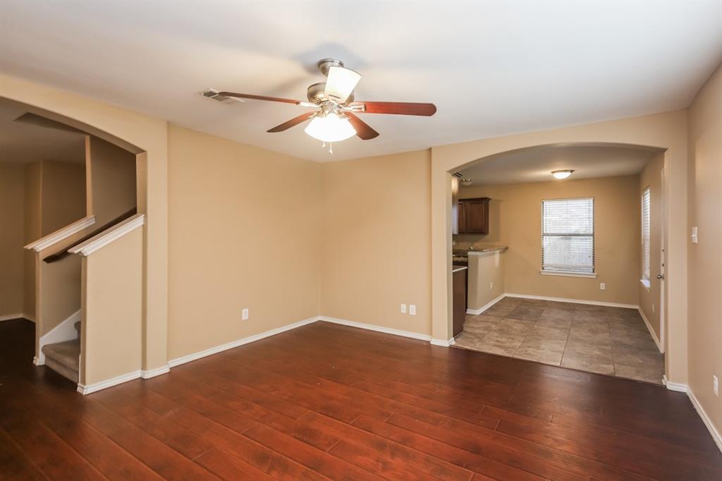 148 Cliff Height Circle Dallas, TX 75241 - Photo 15 of 17 wooden floor in an empty room with a window