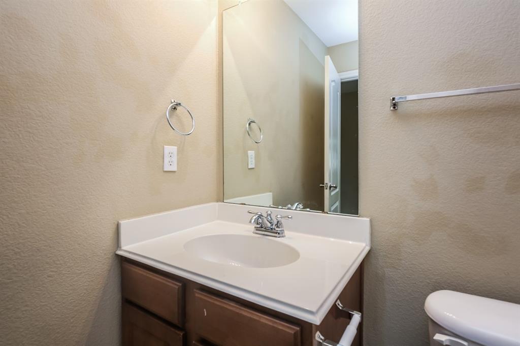 148 Cliff Height Circle Dallas, TX 75241 - Photo 2 of 17 a sink and a mirror
