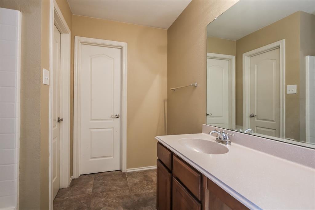 148 Cliff Height Circle Dallas, TX 75241 - Photo 3 of 17 a bathroom with a sink and a mirror